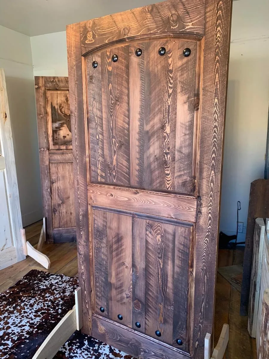 Arched two-panel rustic wood door